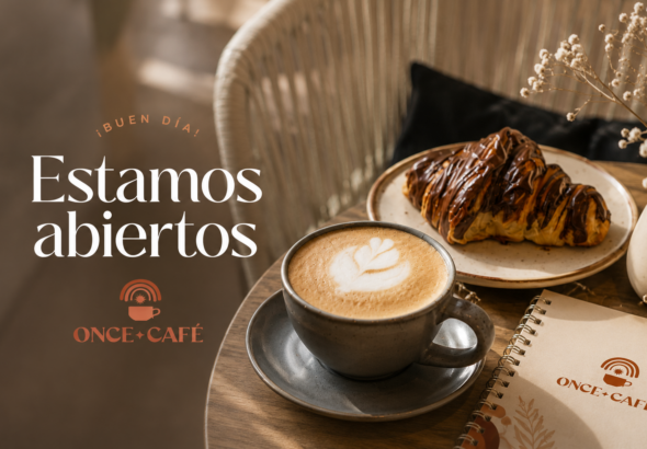 A latte and chocolate croissant sit beside Once Café branding in a cozy setting announcing, “Estamos abiertos” in Narvarte.